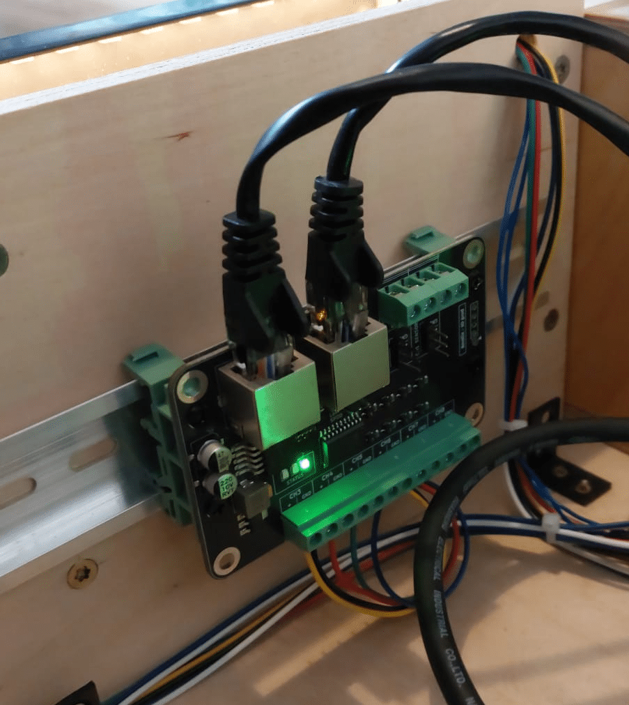 DIN-rail mounted escape room control hardware module used in Realix ERC automation system